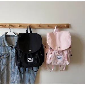 Detail view of casual nylon backpack showing pocket and strap design, ideal for daily commute.