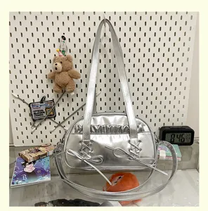 Silver metallic ballet style shoulder bag with ribbon bow and ruffles for women and girls.