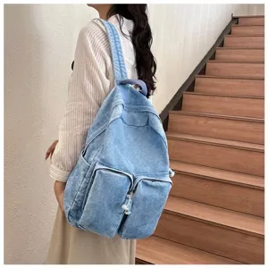Casual retro denim backpack for students, stylish lightweight school bag with multi pockets.
