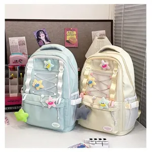 Zaino scolastico coreano multifunzione con simpatici ciondoli in peluche a stella per studenti.