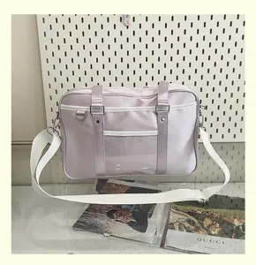 Detail shot of the light purple pearlescent JK uniform pain bag featuring clear display pocket.