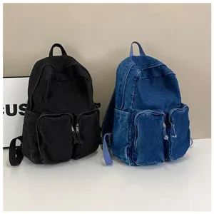 Retro denim backpack for men, casual student school bag with front pockets and comfortable straps.