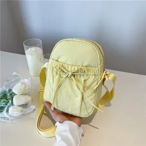 Japanese minimalist waterproof nylon bow crossbody bag casual lightweight shoulder bag.