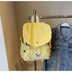 Casual minimalist oxford fabric backpack for women, large capacity, stylish commuter travel bag.