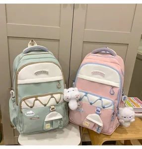 Mochila escolar pastel bonita de gran capacidad, múltiples bolsillos y adorables dijes de felpa.