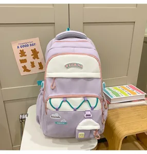 Mochila escolar morada pastel bonita para niñas, gran bolsa con parches encantadores.