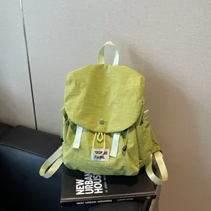 Casual green oxford cloth backpack for women, daily commute travel bag with large capacity.