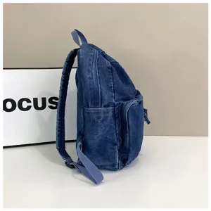 Vintage denim backpack for men, casual minimalist school bookbag with side pockets.