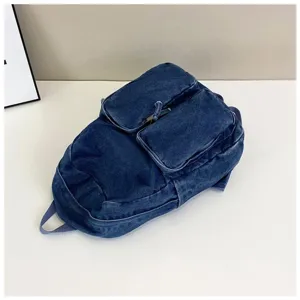 Men's minimalist denim backpack retro Japanese style casual school bag for daily use.