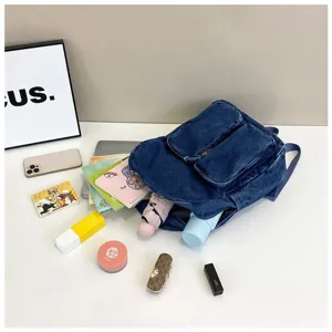 Retro Japanese style denim backpack for men, casual student schoolbag with spacious compartments.