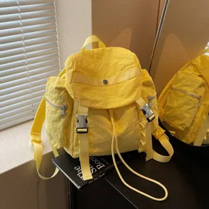 Casual yellow nylon backpack with multi pockets and buckle straps, lightweight and stylish.