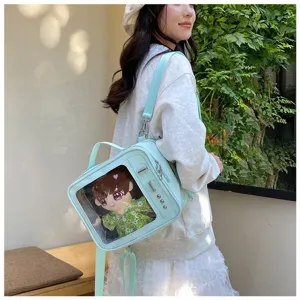 Light blue transparent window ita bag detail with cute plush doll, stylish daily shoulder strap.