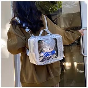 Detailed view of clear window ita bag showcasing a plush doll, versatile backpack.