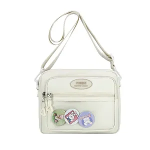 Γυναικεία τσάντα χιαστί νάιλον ita bag με διαφανή τσέπη μπροστά και χαριτωμένα pins.