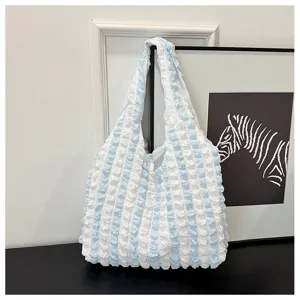 Blue white striped bubble texture shoulder bag detail shot for casual daily style