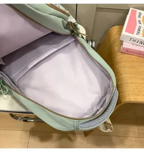 Mochila escolar verde menta con forro lavanda gran capacidad para estudiantes