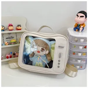 Detailed view of the cute TV-shaped transparent ita bag showcasing a plush doll inside clearly.