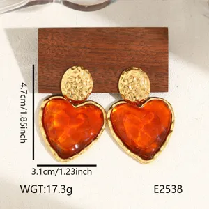 Chic 18K gold plated stainless steel heart earrings with amber resin, elegant jewelry.
