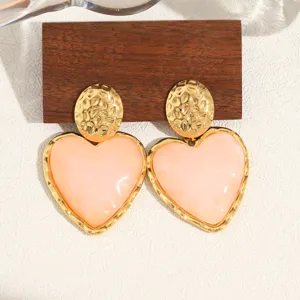 Chic 18K gold plated stainless steel heart earrings with pink marble resin drops for women.