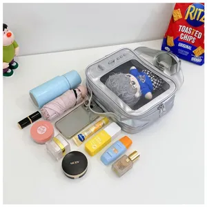 Detail view of the silver transparent ita bag showing large capacity storage and doll display.