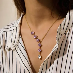Stainless steel clover necklace with purple stones and teardrop pendant for women detail view.