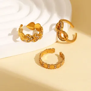 Set of three trendy gold stainless steel open rings featuring hearts and geometric designs.
