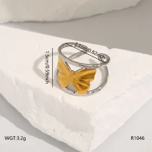 Stainless steel open ring detail, gold butterfly design, lightweight fashion jewelry item.