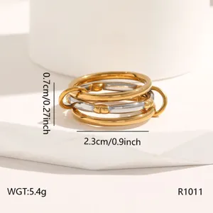Detailed view of the multi-layer interlocking stainless steel ring, highlighting unique metal finish.