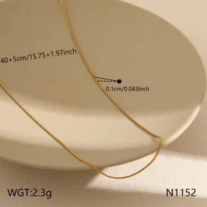 Detailed close-up view of dainty gold stainless steel clavicle chain fashion necklace.