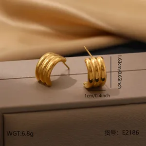 Gold stainless steel geometric ribbed hoop earrings detailed close up view lightweight daily wear.