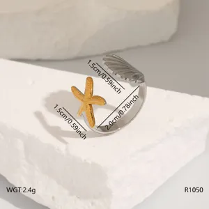 Stainless steel open ring featuring starfish and seashell design, elegant fashion jewelry.