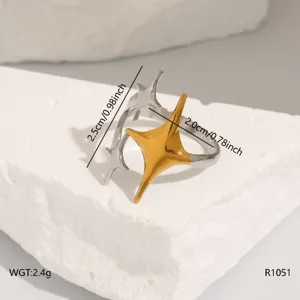 Detailed view of asymmetric star open ring in stainless steel with dual-tone finish.