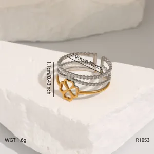Stainless steel multi-layer open ring detail showcasing unique clover design and size.