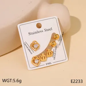 Gold stainless steel earrings set featuring heart and crown designs for chic daily wear.