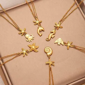 Golden stainless steel ocean theme necklace detail featuring cute animal charms for summer.