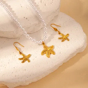 Stunning golden starfish pearl necklace and earrings set, perfect for summer ocean chic style.