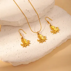 Gold octopus pendant necklace and earrings set, stainless steel ocean jewelry detail.