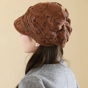 Breathable lace brimmed hat for women, stylish floral hollow design, comfortable daily wear.