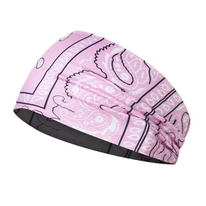 Pink paisley print headband for sports, yoga, and running, elastic and comfortable fit.