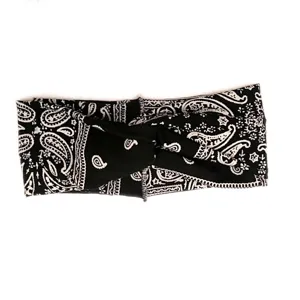 Close-up detail shot of black and white paisley print twisted hair band fabric texture.