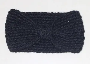 Detailed close-up of the black knitted winter headband, warm fleece knit with cute bow design.