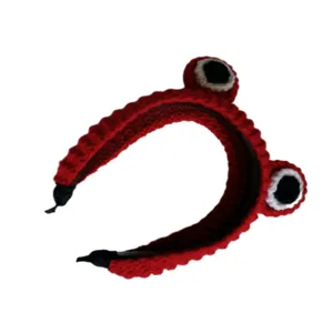 Detailed view of the red crocheted cute animal eye headband, perfect for playful daily wear.