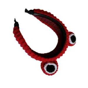 Red crochet cute cartoon eye headband detail view, soft plush material, comfortable wear.