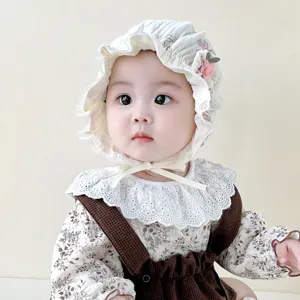 Cute baby lace bonnet hat with floral pattern and delicate bow ties for infant girls details