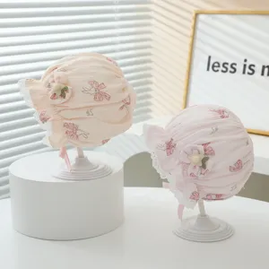 Cute baby girl princess bonnet with cute bunny print lace brim and soft cotton for spring.
