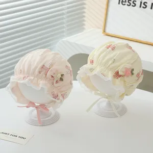 Cute infant baby lace bonnet princess sun hat with bunny print and bow for spring.