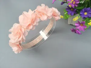 Charming pink flower baby headband with lace elastic band, ideal infant hair photo prop.