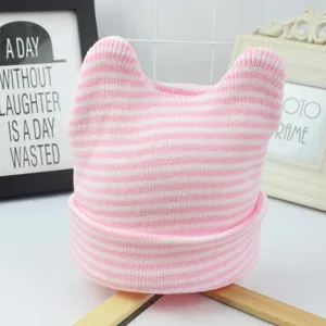 Detailed view of pink and white striped baby beanie with cute cat ears for infants.