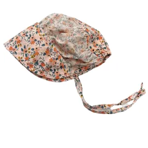 Floral print baby girl bonnet with cute fabric ties, sweet infant sun hat detail view.