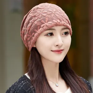 Detail shot of women's stylish breathable lace chemo cap and indoor comfort sleep hat.